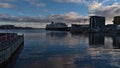 Peaceful view of Svolvaer harbor in evening light with docking Hurtigruten cruise ship MS Midnatsol.