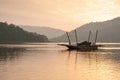 Peaceful view, tourists and vehicle on local car ferry in Sirikit Lake, Nan Province, Thailand. Travelling at sunset time. Summer Royalty Free Stock Photo