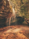 Peaceful waterfall creates a meditative mood in wilde garden Royalty Free Stock Photo