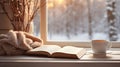 peaceful winter scene, cup on the windowsill, book and blanket Royalty Free Stock Photo