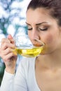 Peaceful woman drinking herbal tea