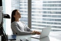 Peaceful woman employee with closed eyes leaning back on chair Royalty Free Stock Photo