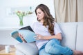 Peaceful woman reading a magazine Royalty Free Stock Photo