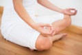 Peaceful woman sitting in lotus pose