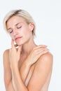 Peaceful woman touching her neck Royalty Free Stock Photo