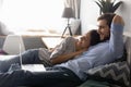 Peaceful young couple watching romantic movie online on computer.