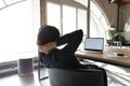 Peaceful young mixed race businesswoman relaxing in office. Royalty Free Stock Photo