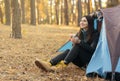 Peaceful young woman drinking tea and looking around Royalty Free Stock Photo