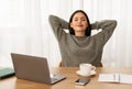 Peaceful young woman entrepreneur relaxing at home office Royalty Free Stock Photo