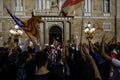 Peacefully protest against the arrests of two Catalan separatist leaders and to demand their liberation