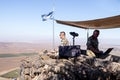 The peacekeeper from the UN forces looks toward Syria, being on a fortified point on Mount Bental, on the Golan Heights in Israel. Royalty Free Stock Photo