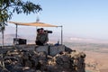 The peacekeeper from the UN forces looks toward Syria, being on a fortified point on Mount Bental, on the Golan Heights in Israel.
