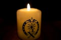 Peacelight of Betlehem candle is burning in front of black background Royalty Free Stock Photo