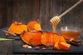 Peaces of baked butternut squash pumpkin with honey and nuts Royalty Free Stock Photo