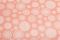 Peach background with snowflakes cut out of paper, scrapbooking paper Royalty Free Stock Photo