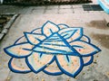 Peach and blue pyramid and gold dot spiral spiritual labyrinth on concrete in San miguel allende mexico Casa lool beh
