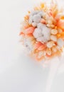 peach color dried flower bouquet from cereal ears cotton and craspedia on snow. reasonable consumption of natural materials