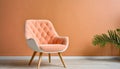 Peach colored armchairs on wooden floor near peach colored wall. Color of the year 2024