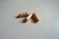 Peach-colored capsules of probiotic dietary supplement three items