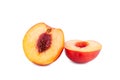 Peach cut into two halves on a white background isolated close up Royalty Free Stock Photo