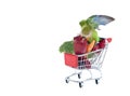 Peach-Faced Lovebird Perched on Shopping Cart filled with Fresh Fruit and Vegetables Eating from an Apple Royalty Free Stock Photo