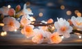 Peach flowers and candle on wooden background. Selective focus