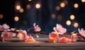 Peach flowers and candle on wooden background. Selective focus