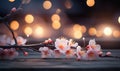 Peach flowers and candle on wooden background. Selective focus