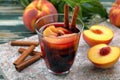 Peach fruit in red wine glass Royalty Free Stock Photo