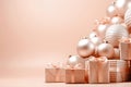 Peach Fuzz holiday Christmas background with festive gift boxes and shiny Christmas ball. Peach Fuzz color of the year