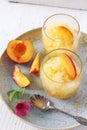 Peach granita and red fruits, frozen summer dessert