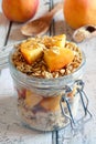 Peach granola overnight breakfast oats on white wood