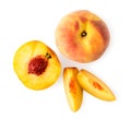 Peach, half with a bone and two pieces on a white. The view of the top. Royalty Free Stock Photo