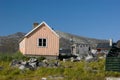 Peach house in Greenland with shed drying fish