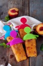 Peach ice lollies on a kitchen napkin Royalty Free Stock Photo