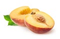 Peach isolated. Two peach half slices fruits and leaves isolated on white with clipping path. Royalty Free Stock Photo