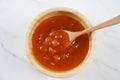 Peach jam in a wooden bowl. Canned fruit jam with ingredients