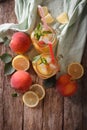 peach lemonade with ice and mint close up in a glass jar. Vertical top view Royalty Free Stock Photo