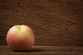 peach on old wood. sunlight