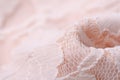 Peach pink fabric textile material texture openwork mesh macro Royalty Free Stock Photo