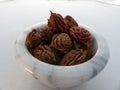 Peach Pits in a Marble Bowl
