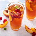 Peach and raspberry iced tea or cocktail Royalty Free Stock Photo