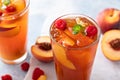 Peach and raspberry iced tea or cocktail Royalty Free Stock Photo