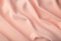 Peach silk background with drapery in the corner Royalty Free Stock Photo