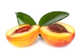 Peach sliced into two halves with leaf on white background isolated close up Royalty Free Stock Photo