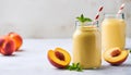 Peach smoothie in glass bottle with paper straw. Tasty and healthy beverage. Delicious summer drink