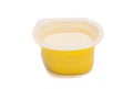 Peach yoghurt in open plastic cup Royalty Free Stock Photo