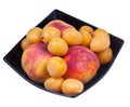 Peaches and apricots in black plate Royalty Free Stock Photo