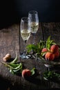 Peaches on branch with champagne Royalty Free Stock Photo