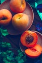 Peaches in dark food. Concept of gastronomy